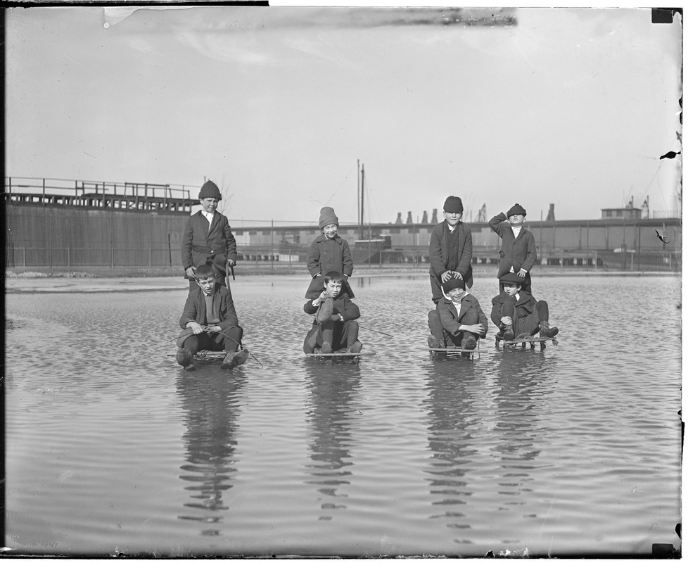 Children sledding on underwater ice