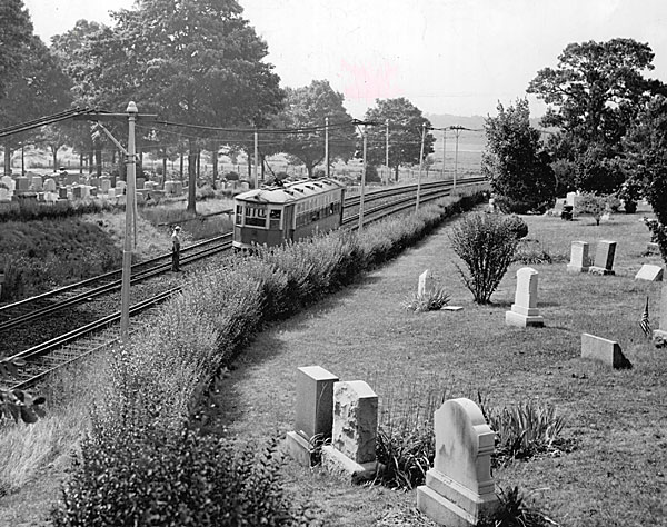 Cedar Grove cemetery, several graves perched along the Mattapan Trolley line