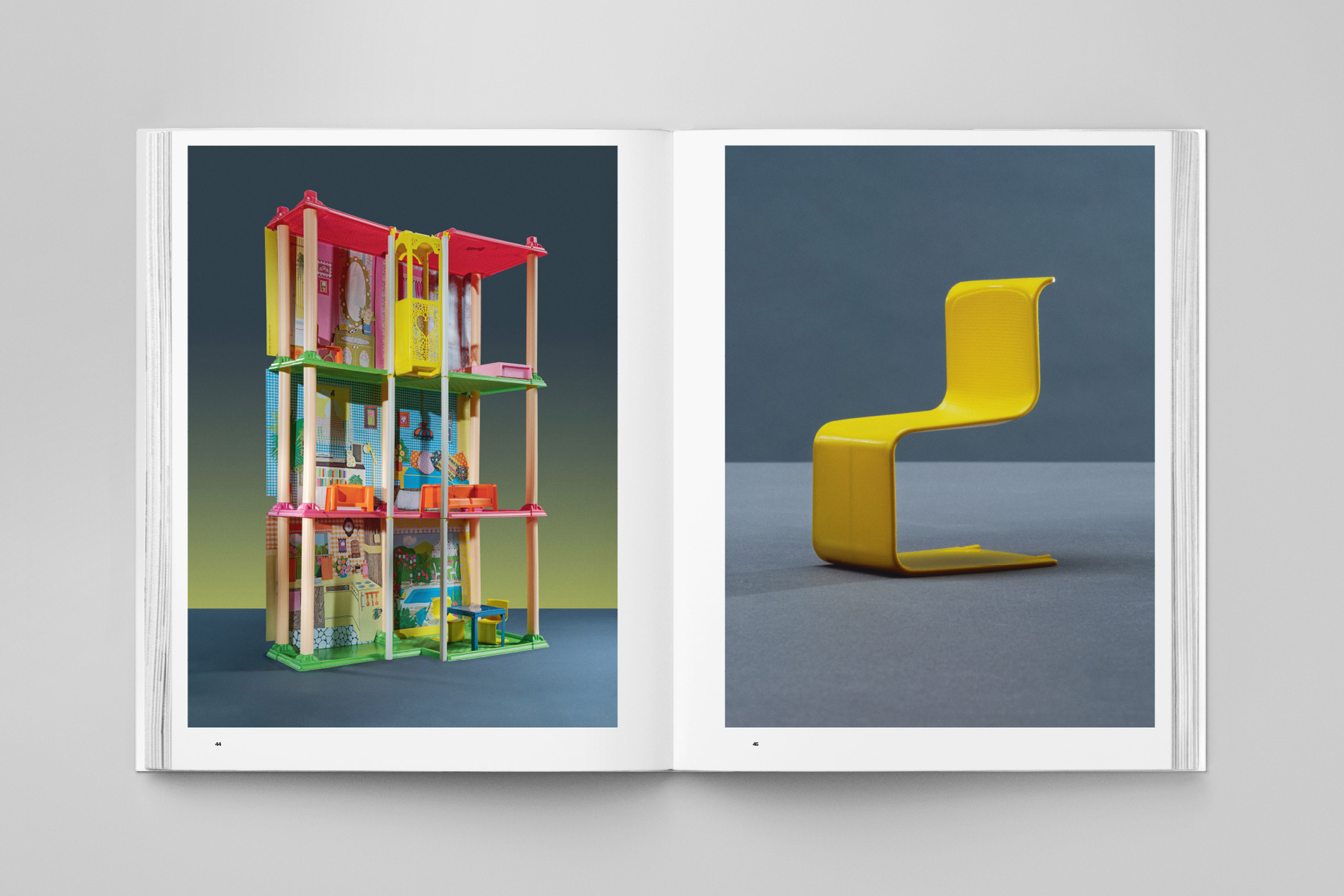 open page showing three tower home and blown up image of plastic chair